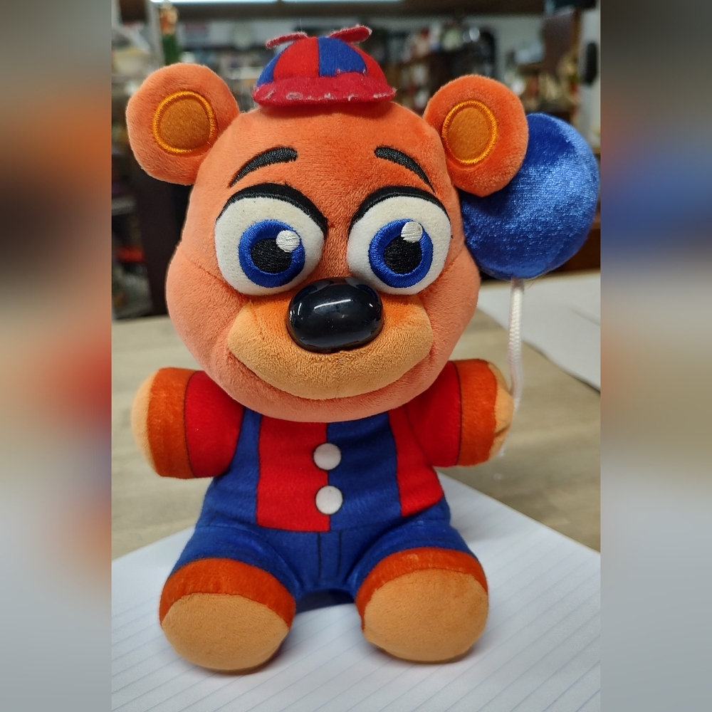 Plush Bear Toy with Blue and Orange Outfit